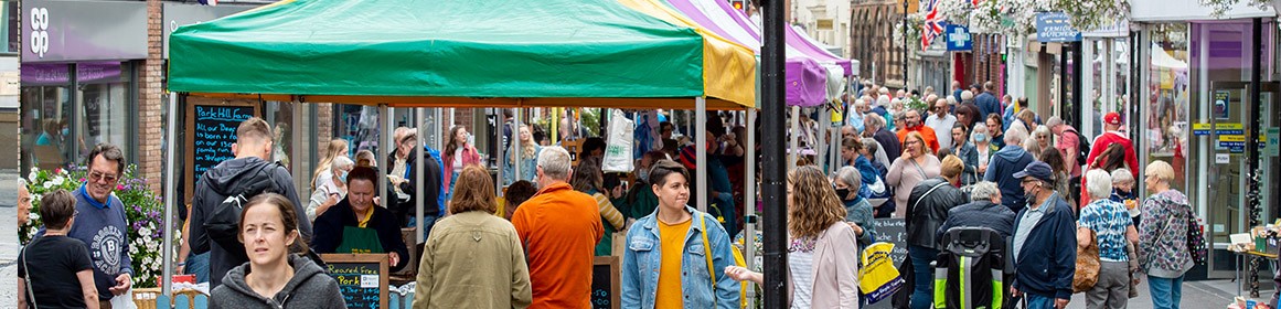 People walking around a market in Stafford