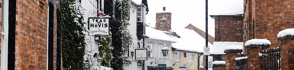 Soup Kitchen sign in Stafford Town Centre whilst snowing
