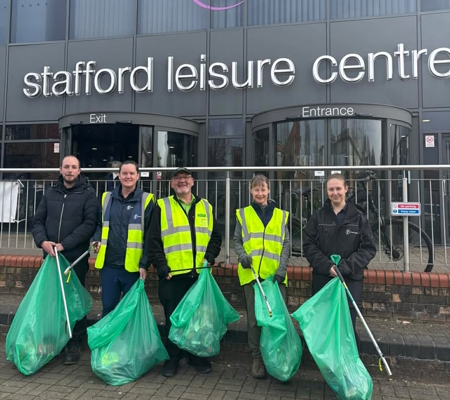 Litter picking group standing outside of Freedom Leisure Centre in Stafford