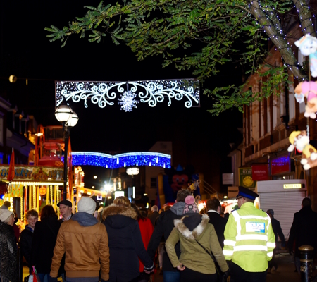 Christmas lights and people in the streets of Stafford
