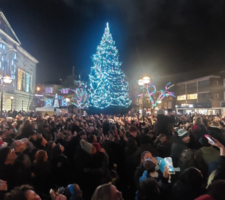 Christmas lights switch-on in Stafford Town Centre with people standing watching
