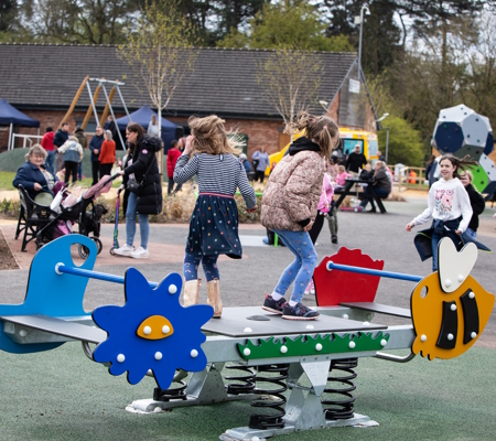 Kids playing together in a Stafford play area