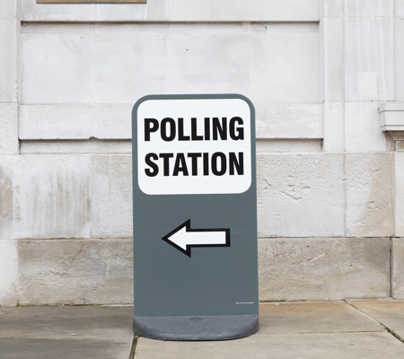 Sign stating the direction (left) to the Polling Station